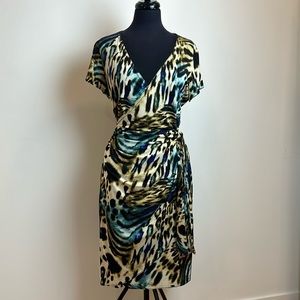 MOB WIFE 👀 Animal print wrap dress. Side tie V-neck cap sleeve stretch stunner!